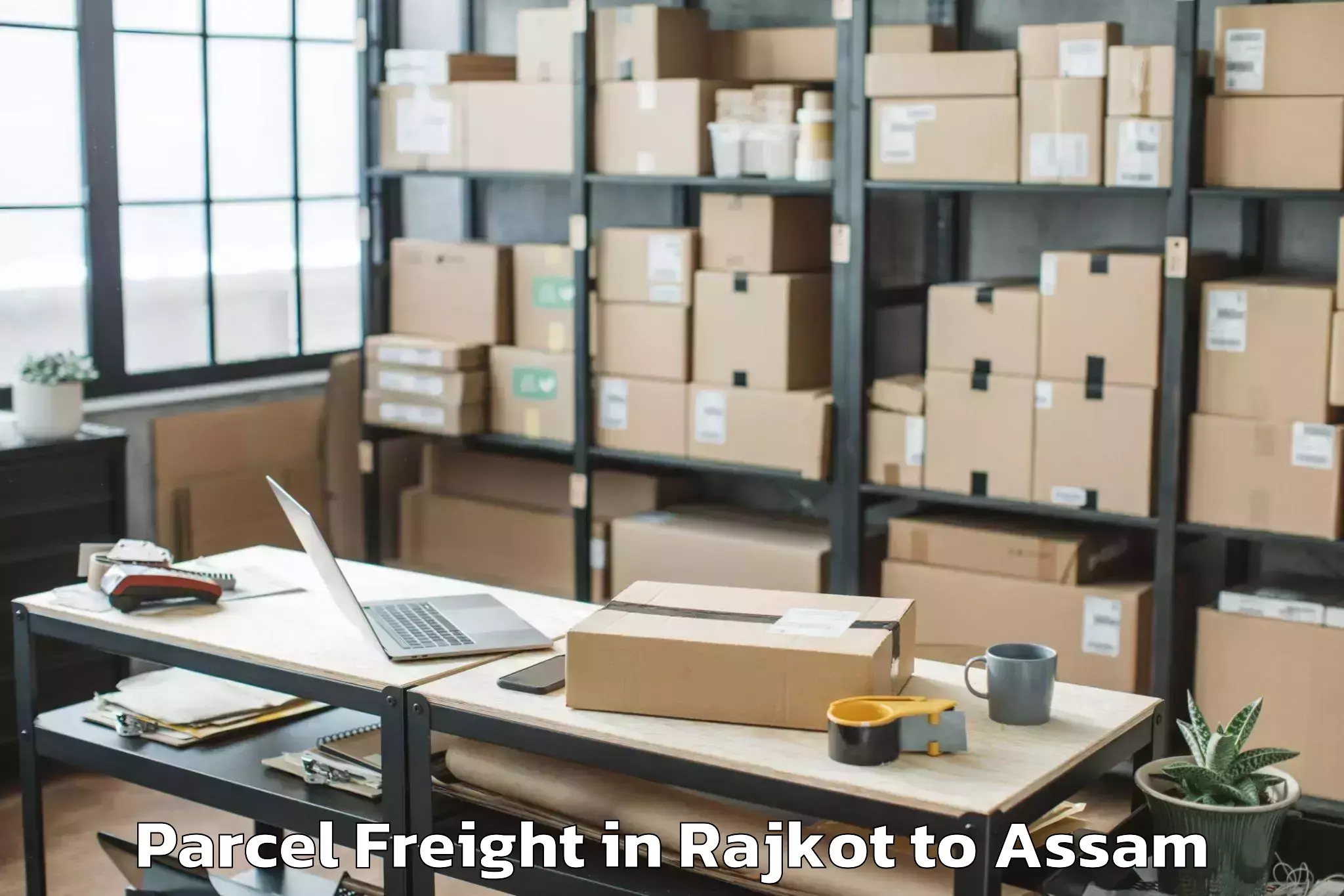 Reliable Rajkot to Udharbond Parcel Freight